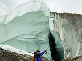 22 Jerome Ryan Points At True Glacier Below The Rubble On The Upper Baltoro Glacier We trekked back from Shagring camp to Concordia in cloudy weather, passing a side section of the Upper Baltoro Glacier that clearly shows that this isn�t just rubble trekking trail, but a real glacier with ice.